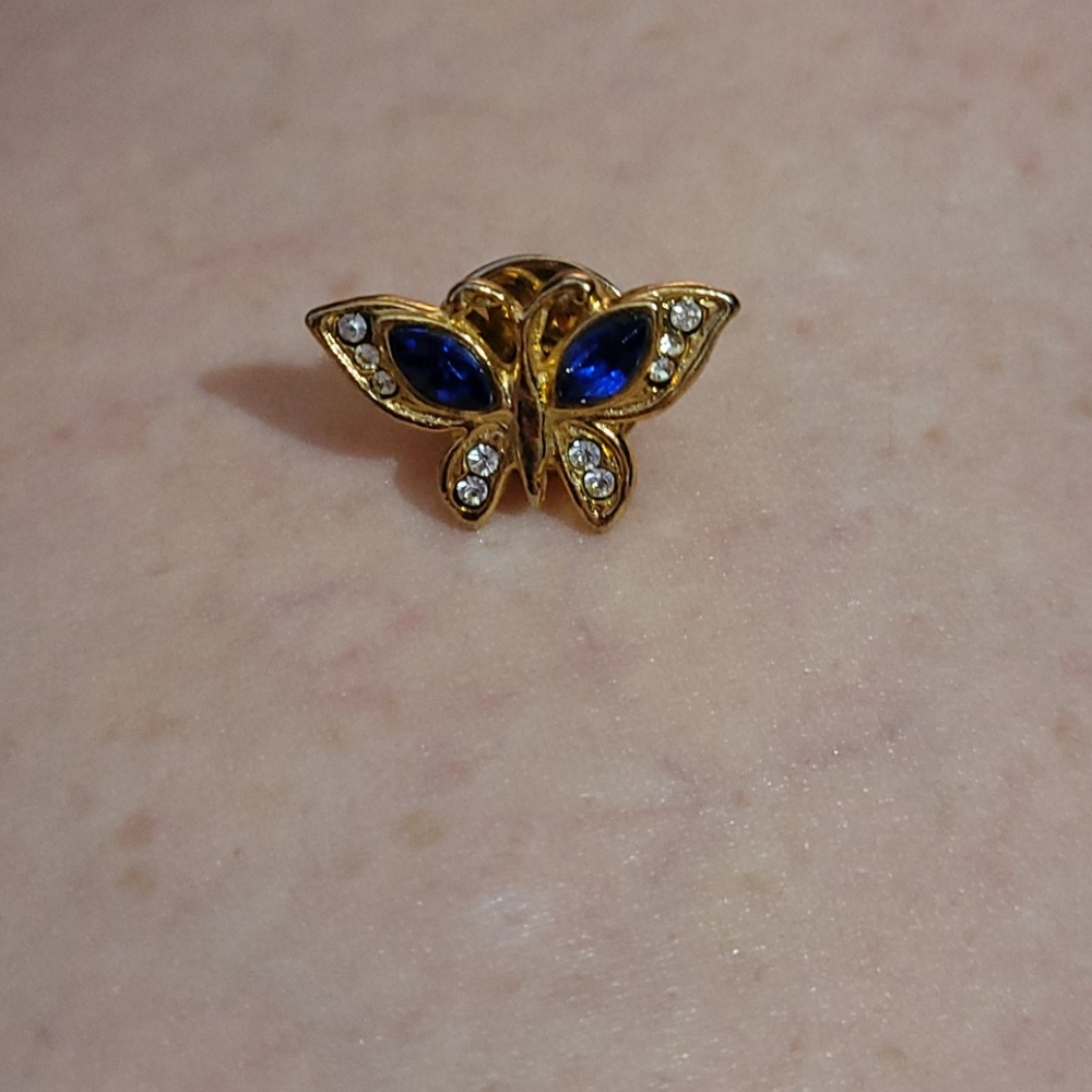 Gold tone butterfly lapel pin with blue & diamond